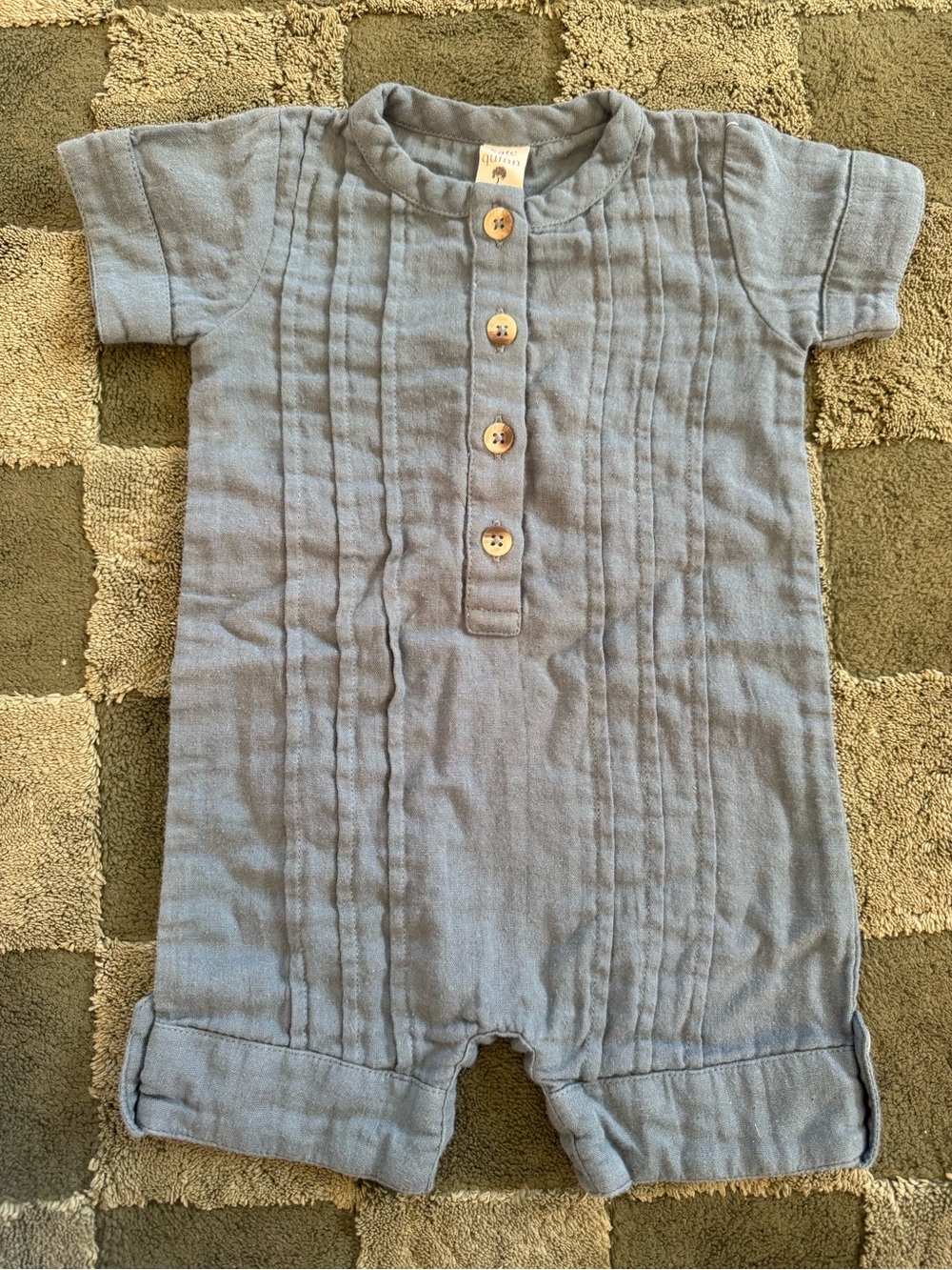 kate quinn soft blue baby romper with wooden buttons